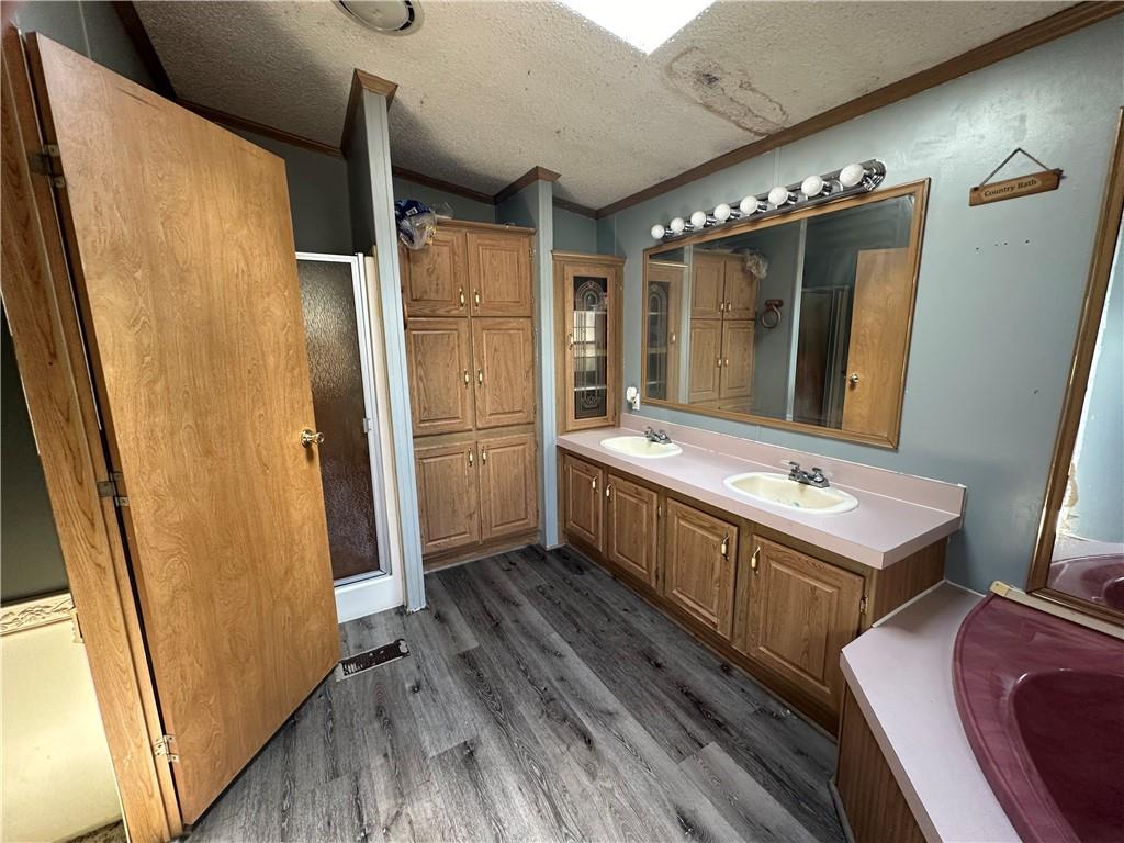 107 Rose Lane Rimersburg, PA 16248 - Photo 17 of 25 a bathroom with a sink a mirror and a shower