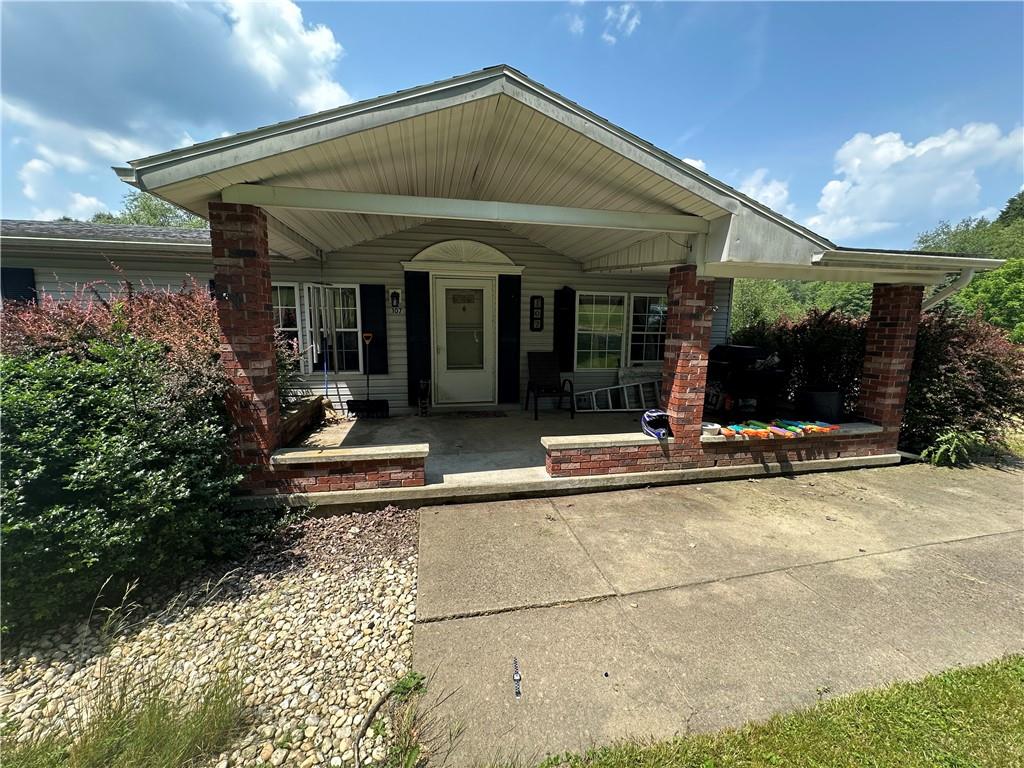 107 Rose Lane Rimersburg, PA 16248 - Photo 2 of 25 a view of a house with potted plants and a table and chairs
