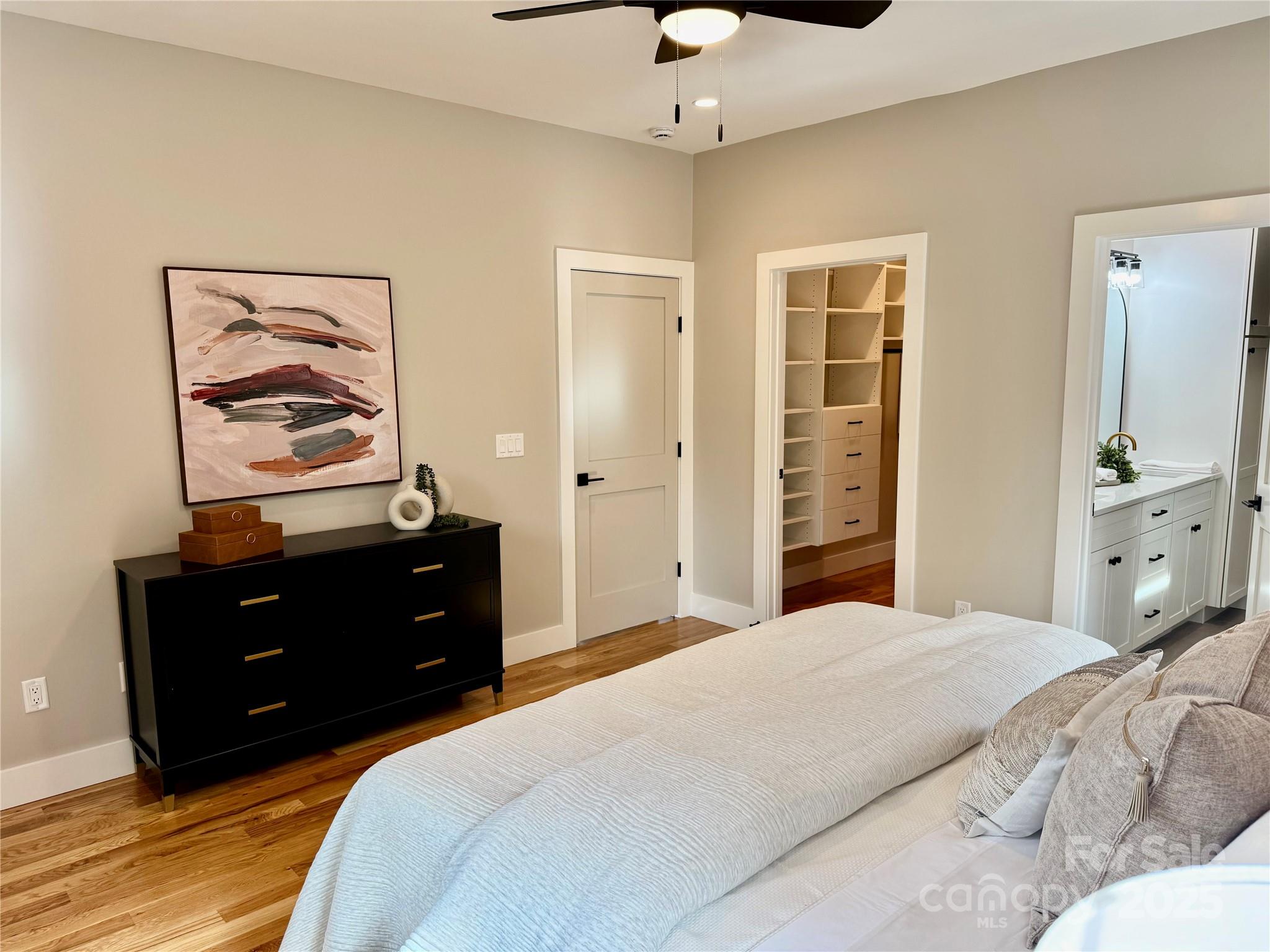 296 Gallimore Road Brevard, NC 28712 - Photo 18 of 36 a bedroom with a bed and a painting on the wall