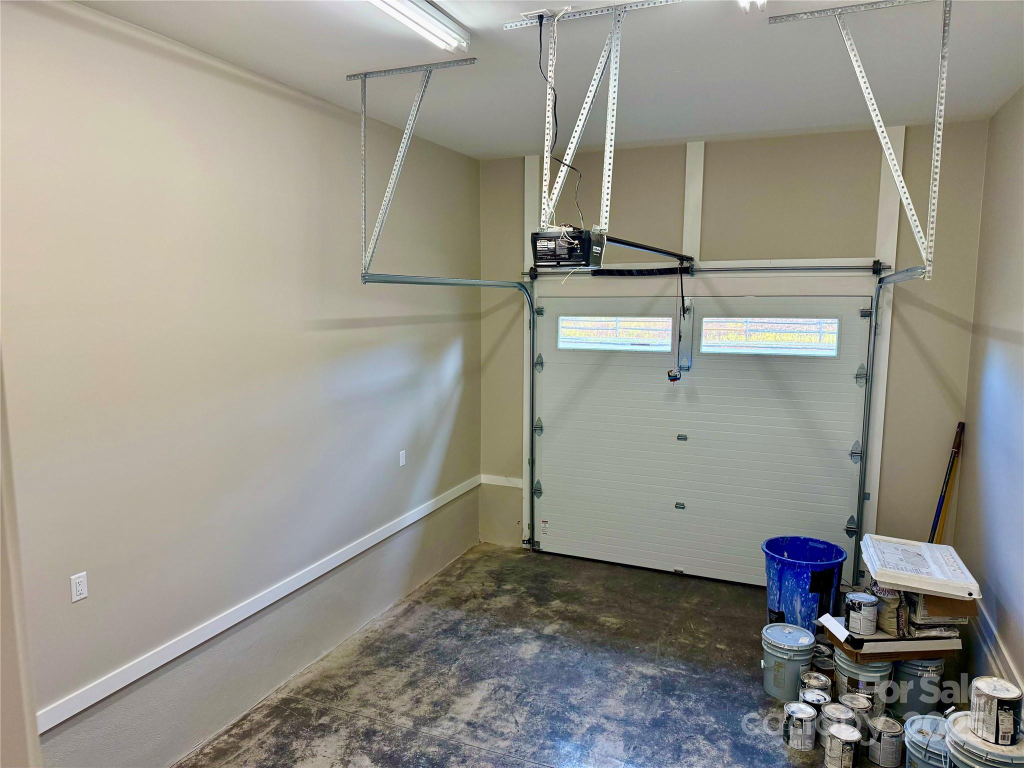 296 Gallimore Road Brevard, NC 28712 - Photo 33 of 36 a room with water heater and wooden cabinets