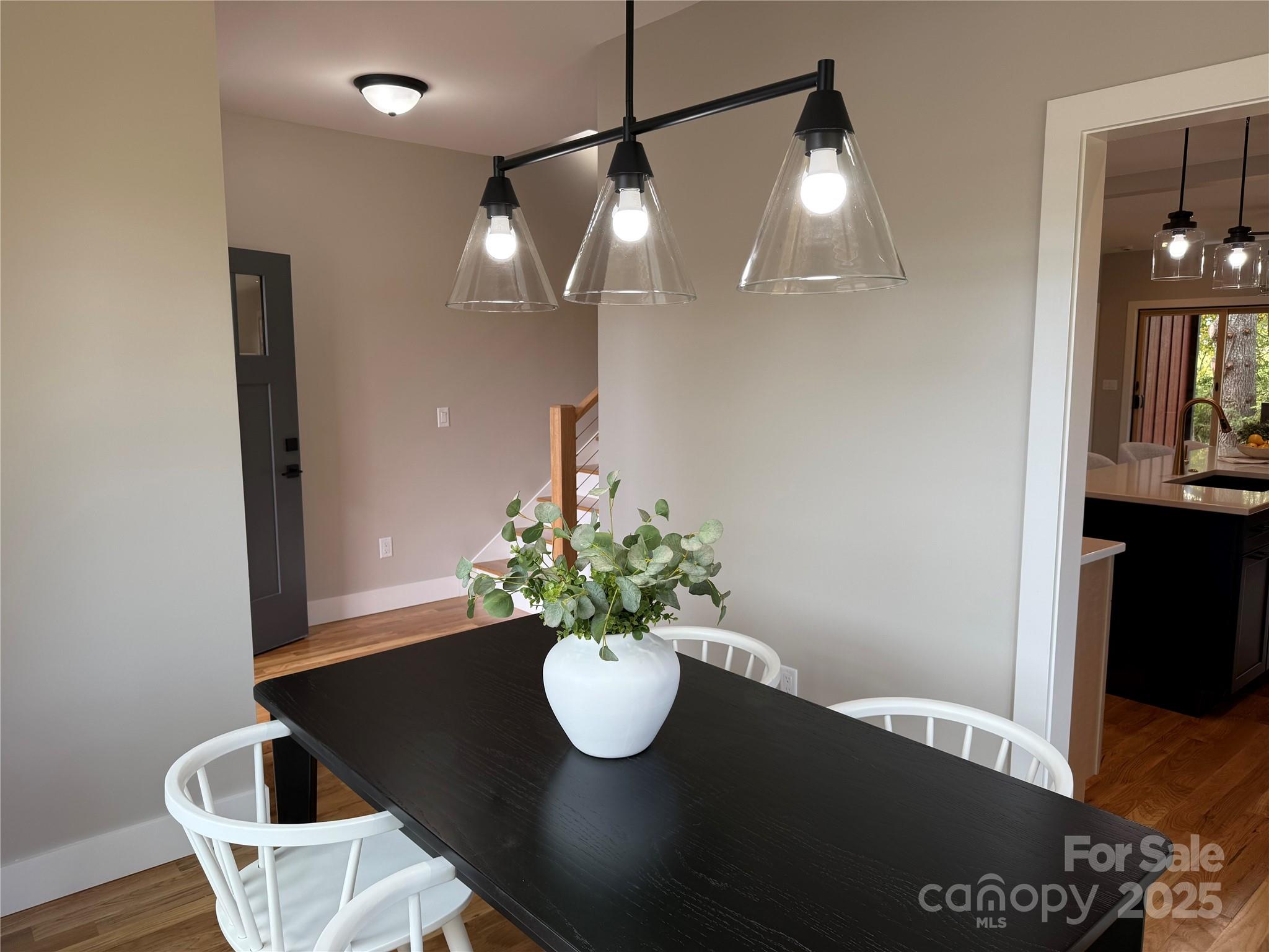296 Gallimore Road Brevard, NC 28712 - Photo 4 of 36 a view of a dining room with furniture and wooden floor