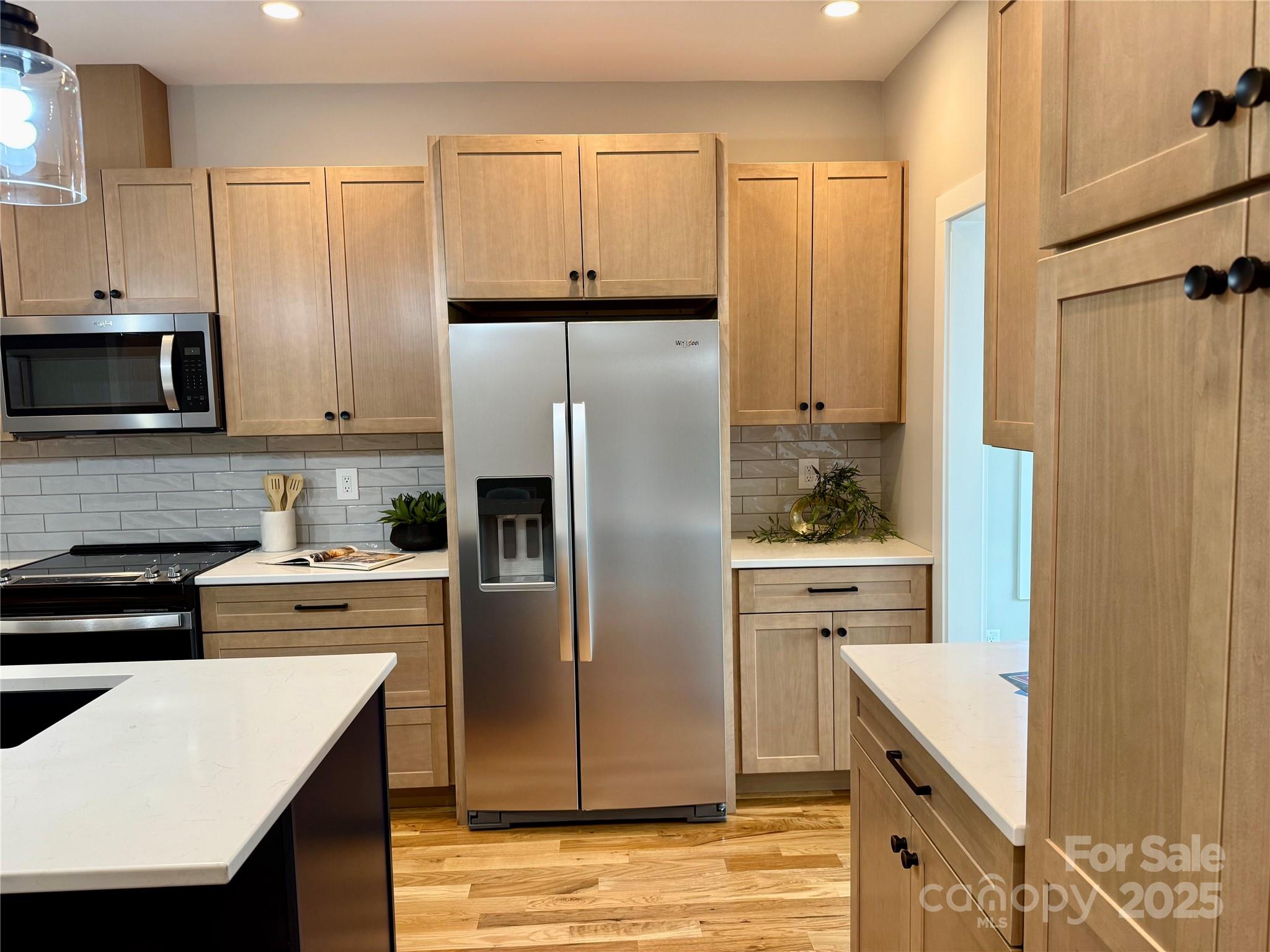 296 Gallimore Road Brevard, NC 28712 - Photo 7 of 36 a kitchen with stainless steel appliances a refrigerator stove and sink