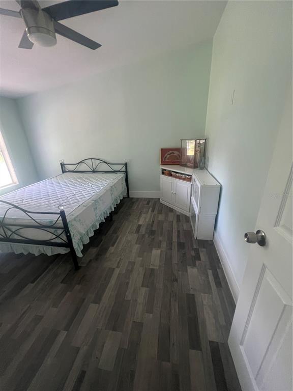 5855 Jack Brack Road St. Cloud, FL 34771 - Photo 68 of 86 a bedroom with a bed and a table