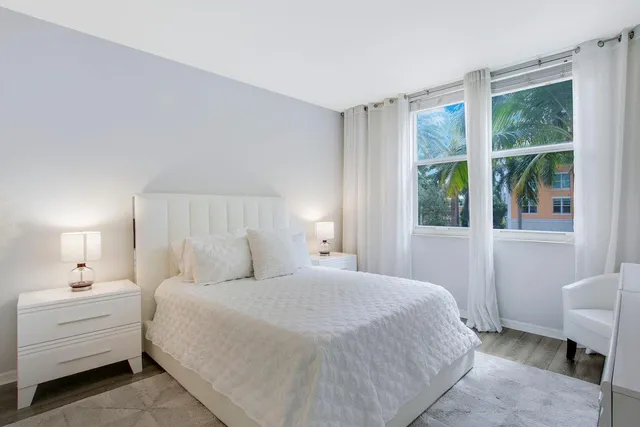 a bed room with a bed and a chair