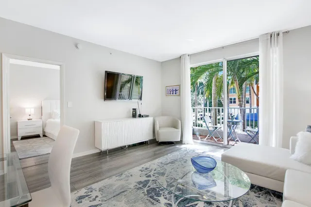 a living room with furniture and a large window