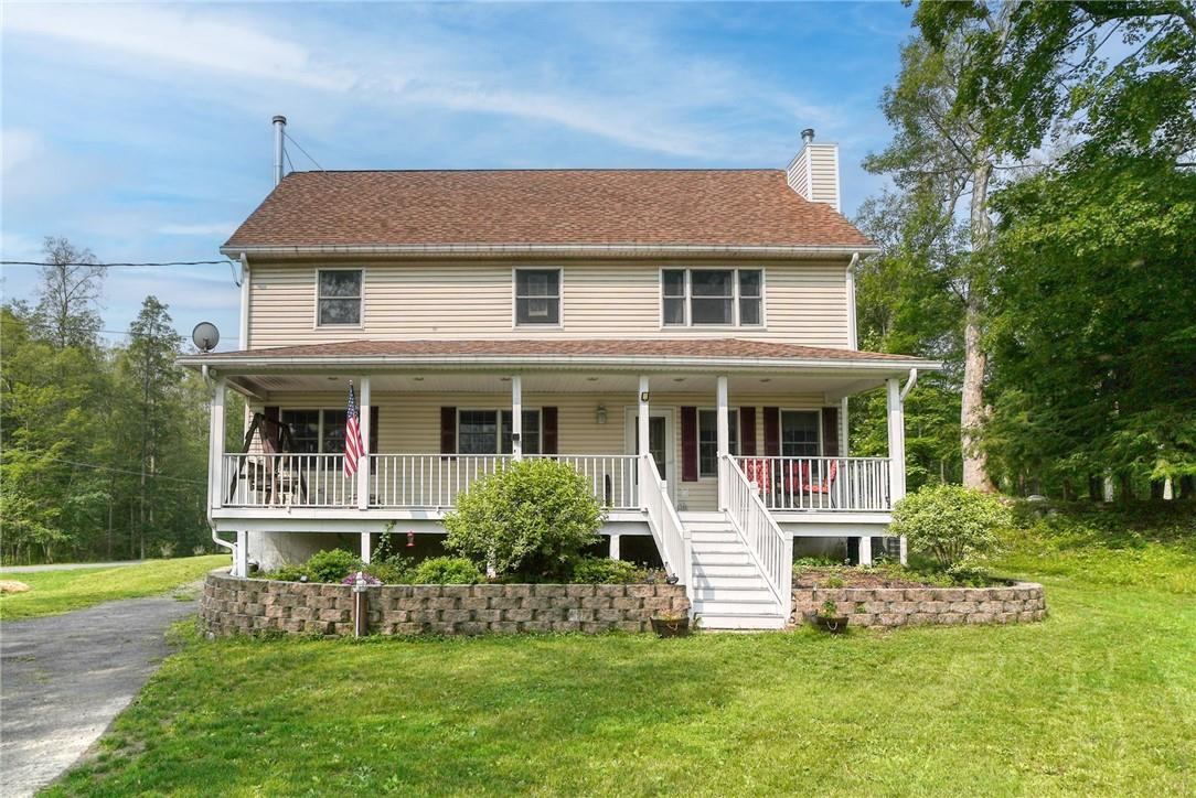 369 Awosting Road Pine Bush, NY 12566 - Photo 1 of 1 a front view of a house with a garden and plants