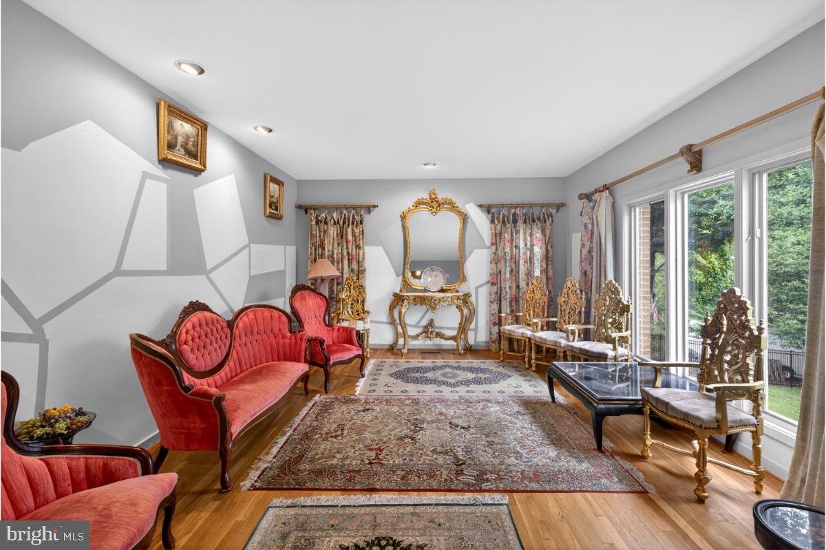 10320 Glen Road Potomac, MD 20854 - Photo 11 of 75 a living room with furniture and large windows