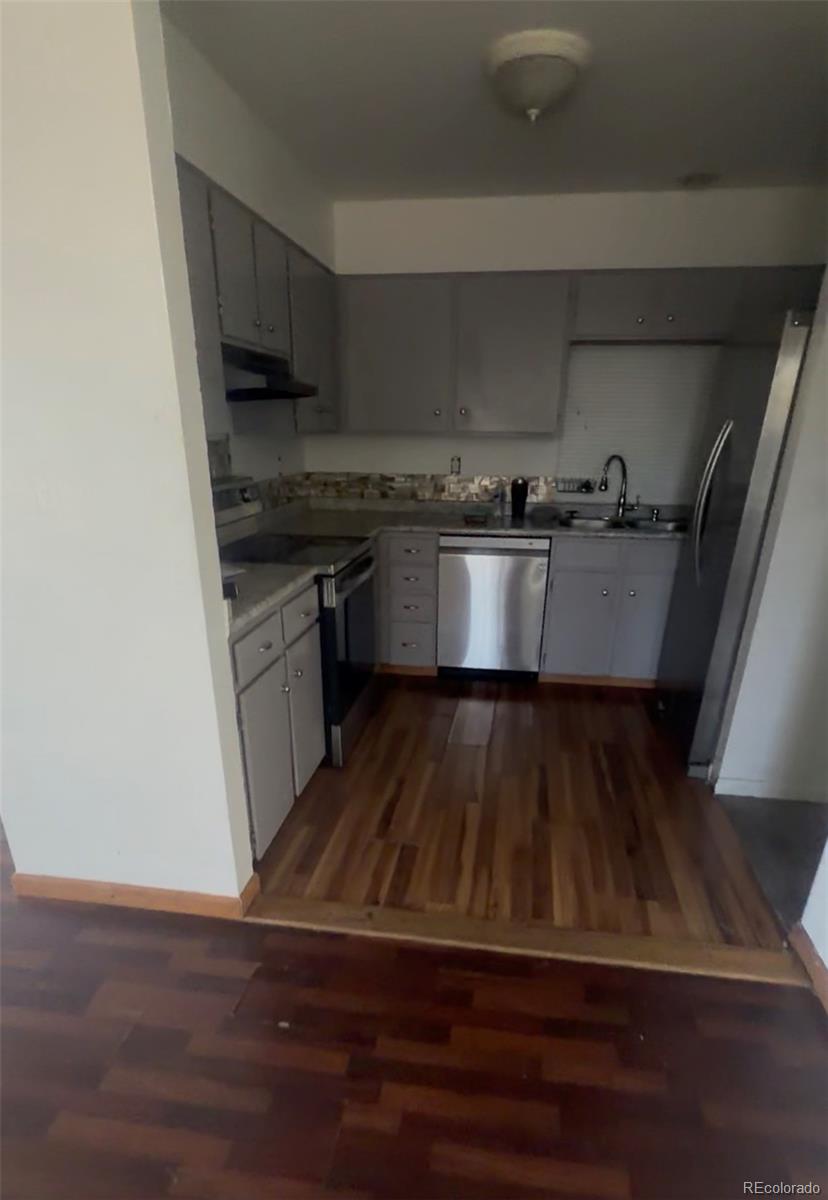7907 York Street, Unit 3 Denver, CO 80229 - Photo 7 of 13 a view of kitchen and wooden floor
