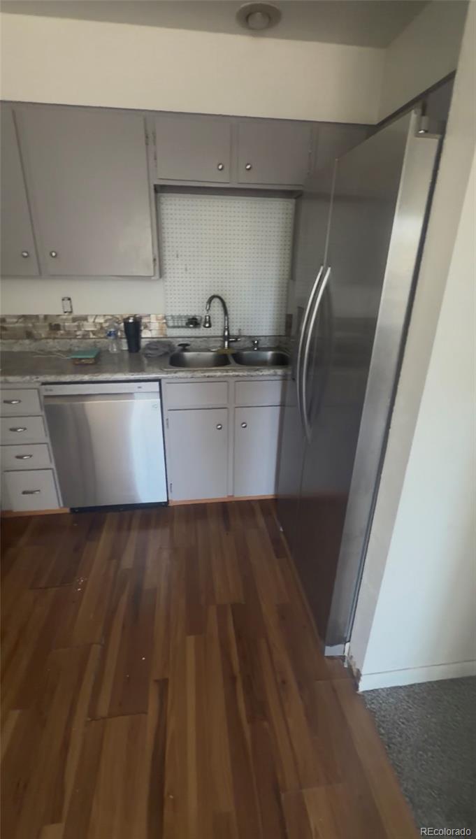 7907 York Street, Unit 3 Denver, CO 80229 - Photo 9 of 13 a view of kitchen island with wooden floor