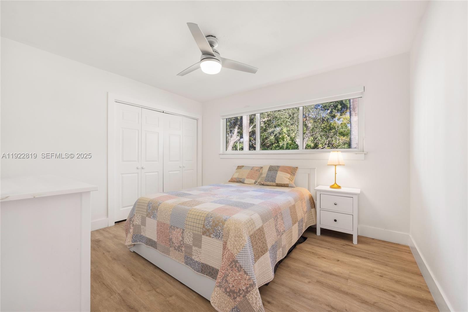 7880 Southwest 132nd Street Pinecrest, FL 33156 - Photo 14 of 22 a bedroom with a bed and a window