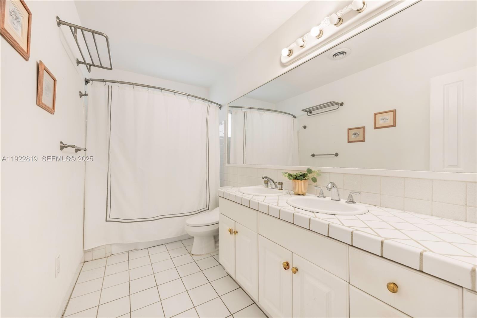 7880 Southwest 132nd Street Pinecrest, FL 33156 - Photo 15 of 22 a bathroom with a sink a toilet and shower