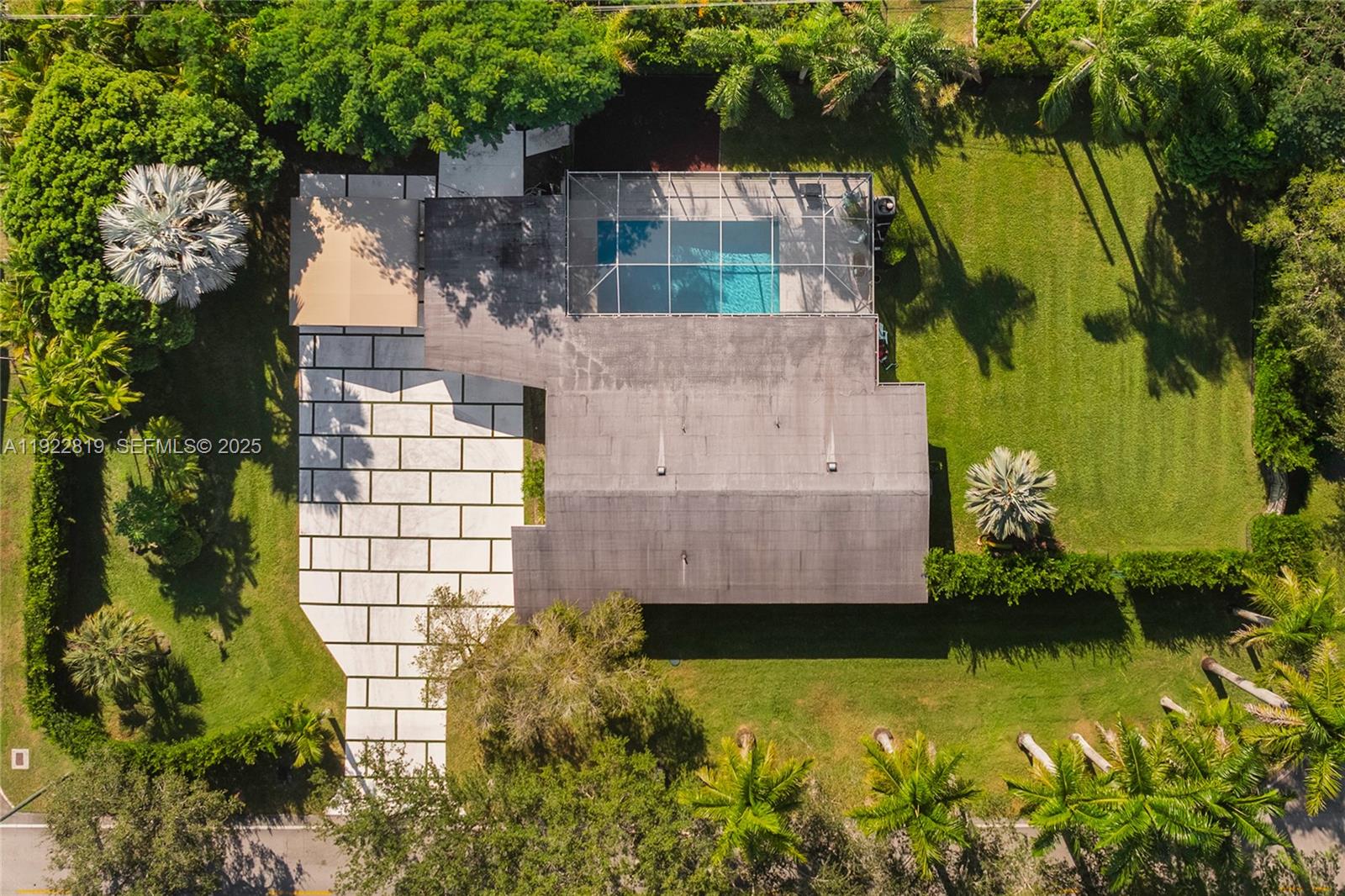 7880 Southwest 132nd Street Pinecrest, FL 33156 - Photo 19 of 22 an aerial view of a house with a yard