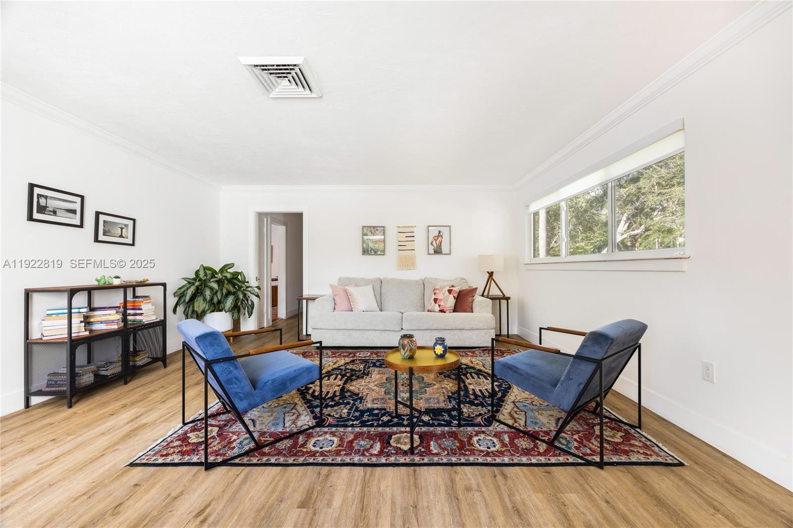 7880 Southwest 132nd Street Pinecrest, FL 33156 - Photo 2 of 22 a living room with furniture a rug potted plant and wooden floor