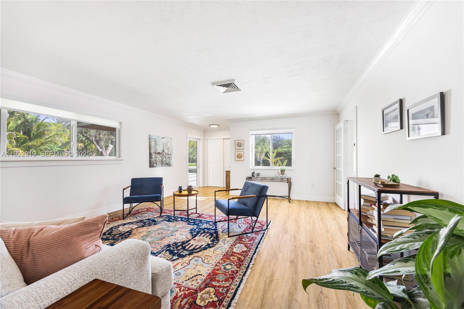 7880 Southwest 132nd Street Pinecrest, FL 33156 - Photo 3 of 22 a living room with furniture wooden floor and a window