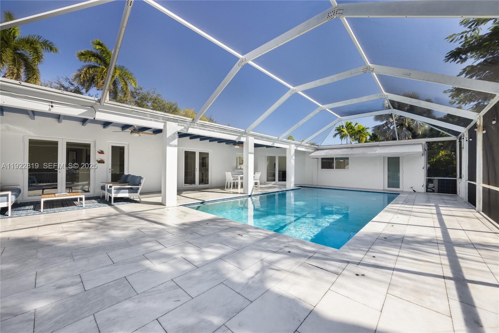 7880 Southwest 132nd Street Pinecrest, FL 33156 - Photo 10 of 22 a view of a house with sitting area and garden