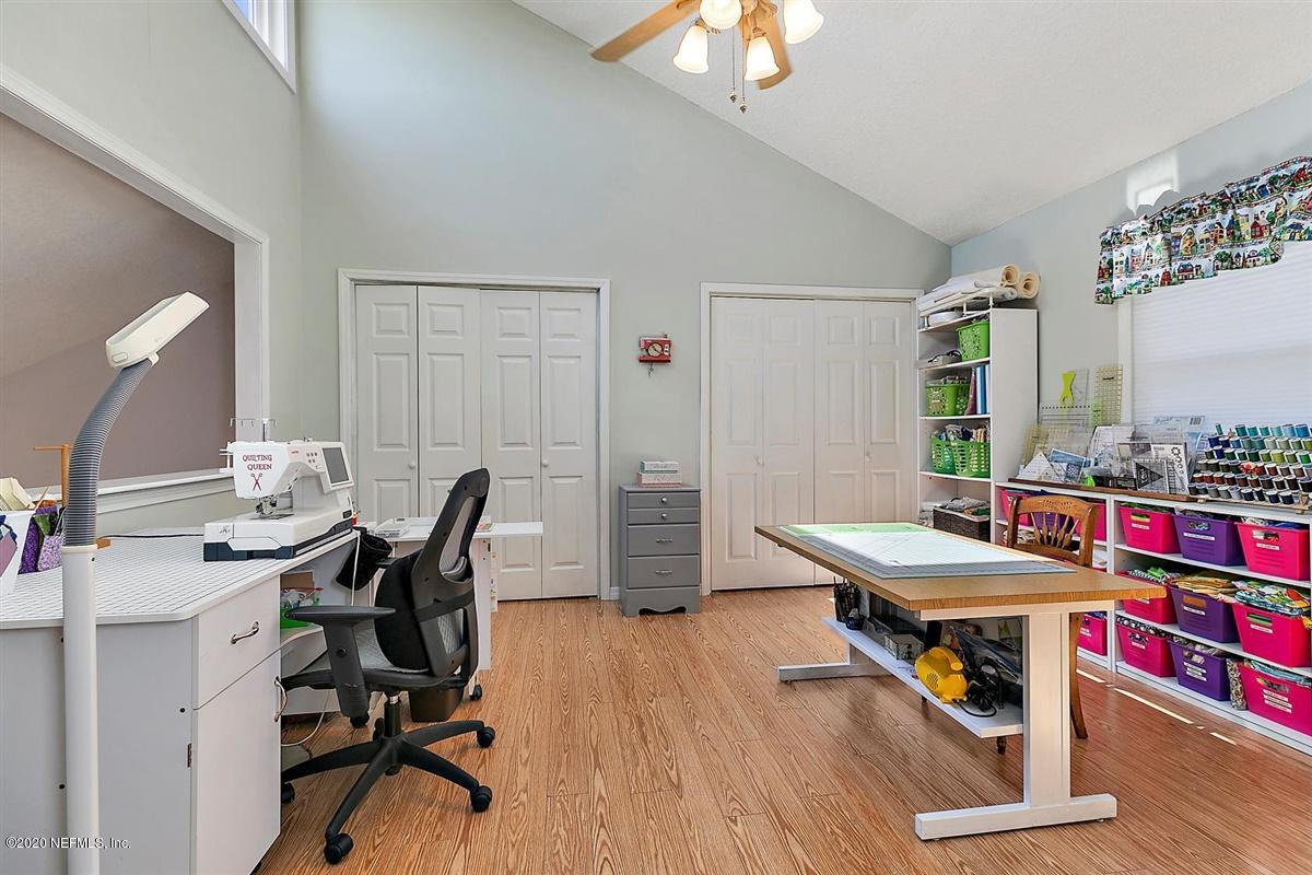 1870 Seminole Road Atlantic Beach, FL 32233 - Photo 17 of 27 a room with a table chairs and a kitchen view