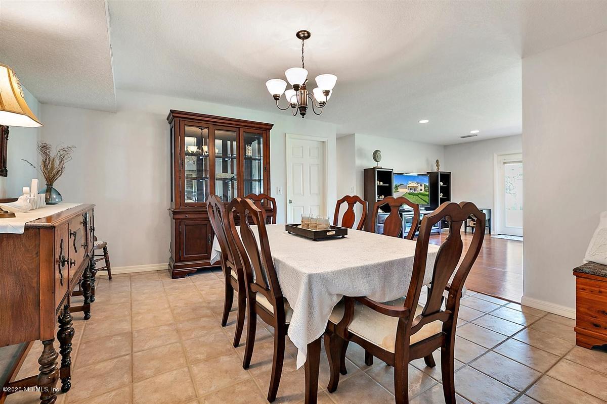 1870 Seminole Road Atlantic Beach, FL 32233 - Photo 5 of 27 a view of a dining room with furniture and chandelier
