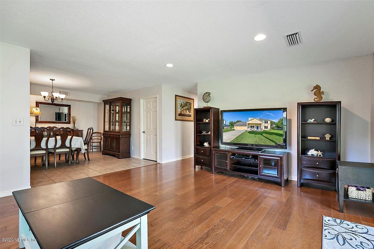 1870 Seminole Road Atlantic Beach, FL 32233 - Photo 9 of 27 a living room with furniture and a flat screen tv