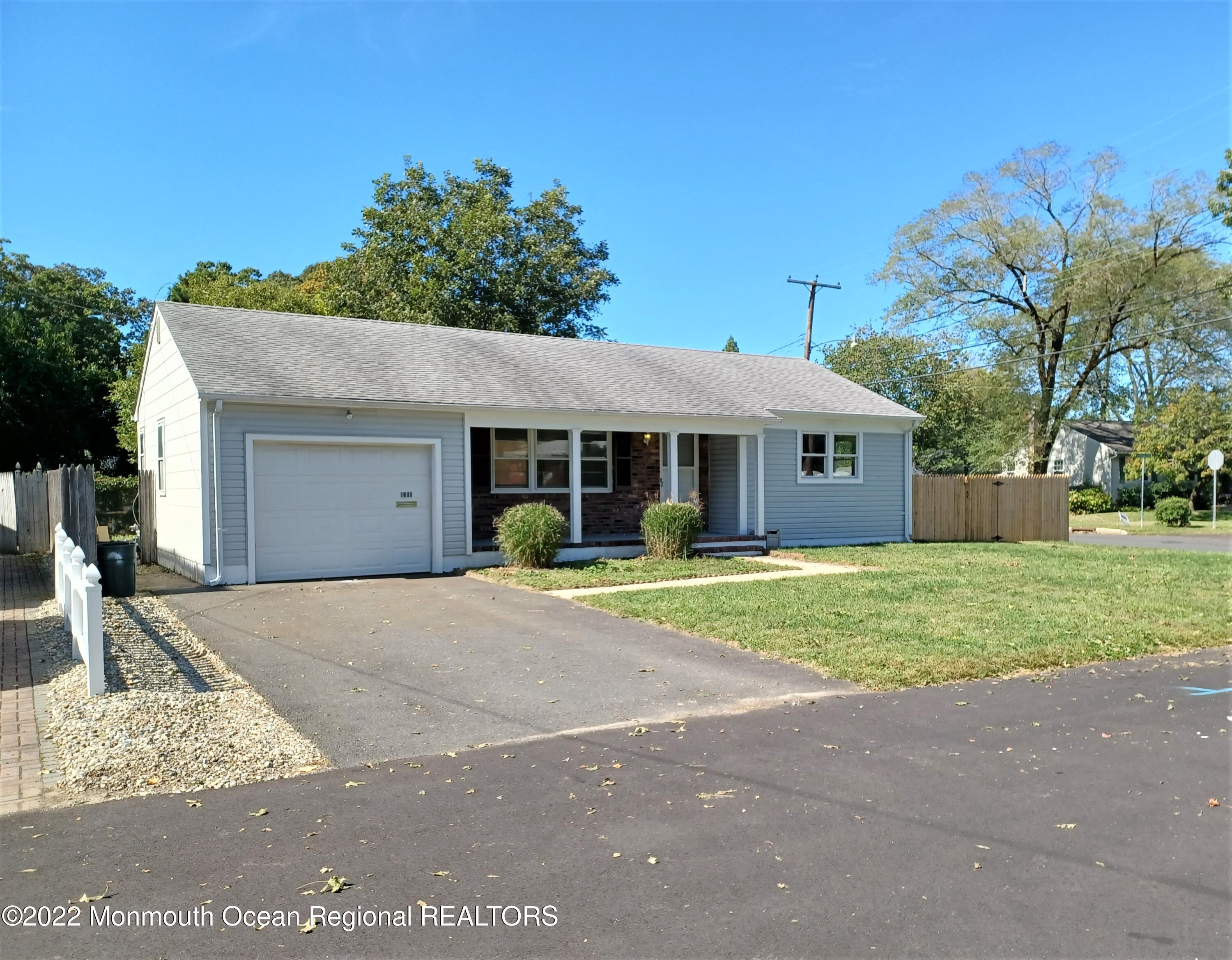 1301 Charles Street Point Pleasant, NJ 08742 - Photo 1 of 24 a front view of a house with a yard and porch