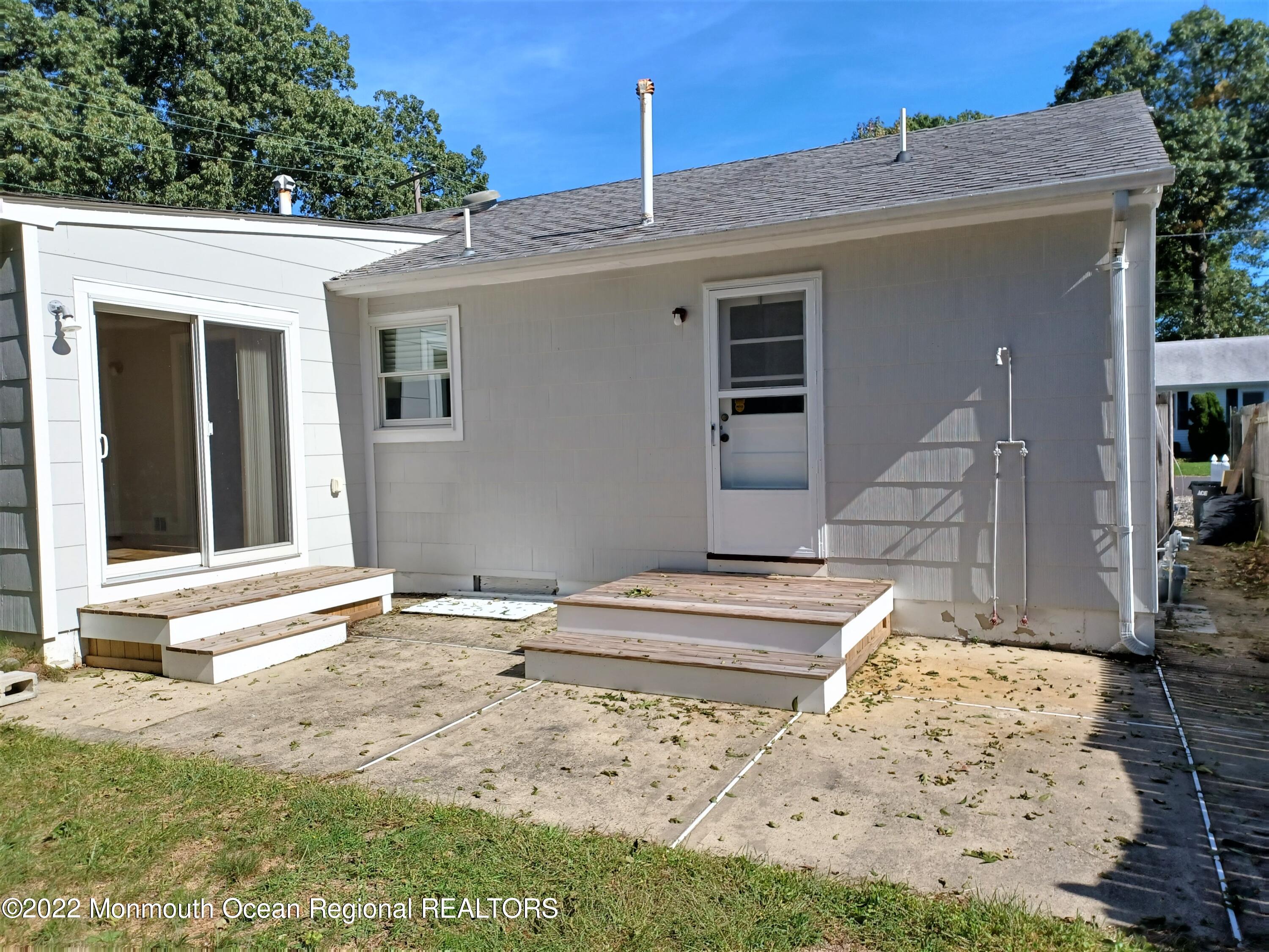 1301 Charles Street Point Pleasant, NJ 08742 - Photo 21 of 24 a view of a house with a backyard