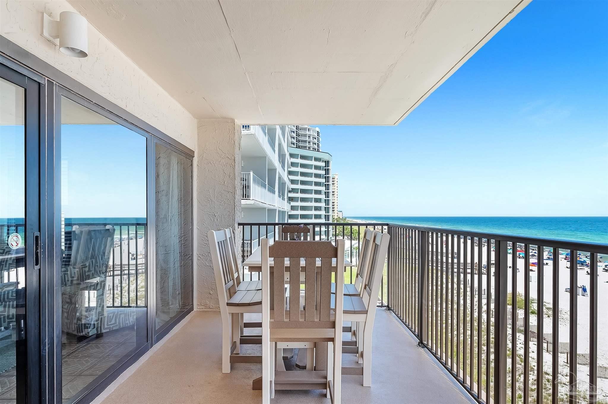 13817 Perdido Key Drive, Unit 501 Pensacola, FL 32507 - Photo 13 of 63 a view of a chairs and table in kitchen