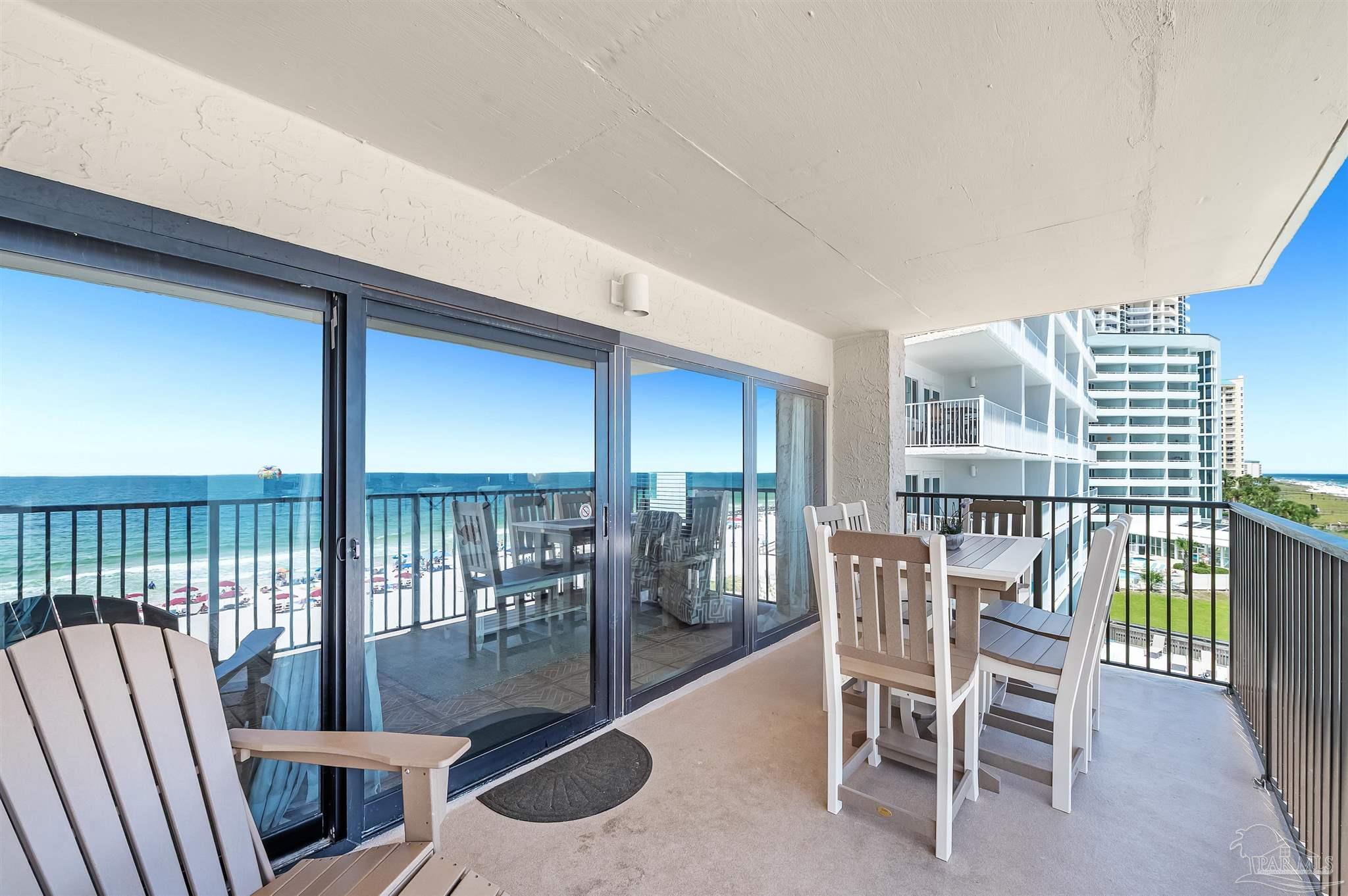 13817 Perdido Key Drive, Unit 501 Pensacola, FL 32507 - Photo 15 of 63 a view of a dining room with furniture window and outside view