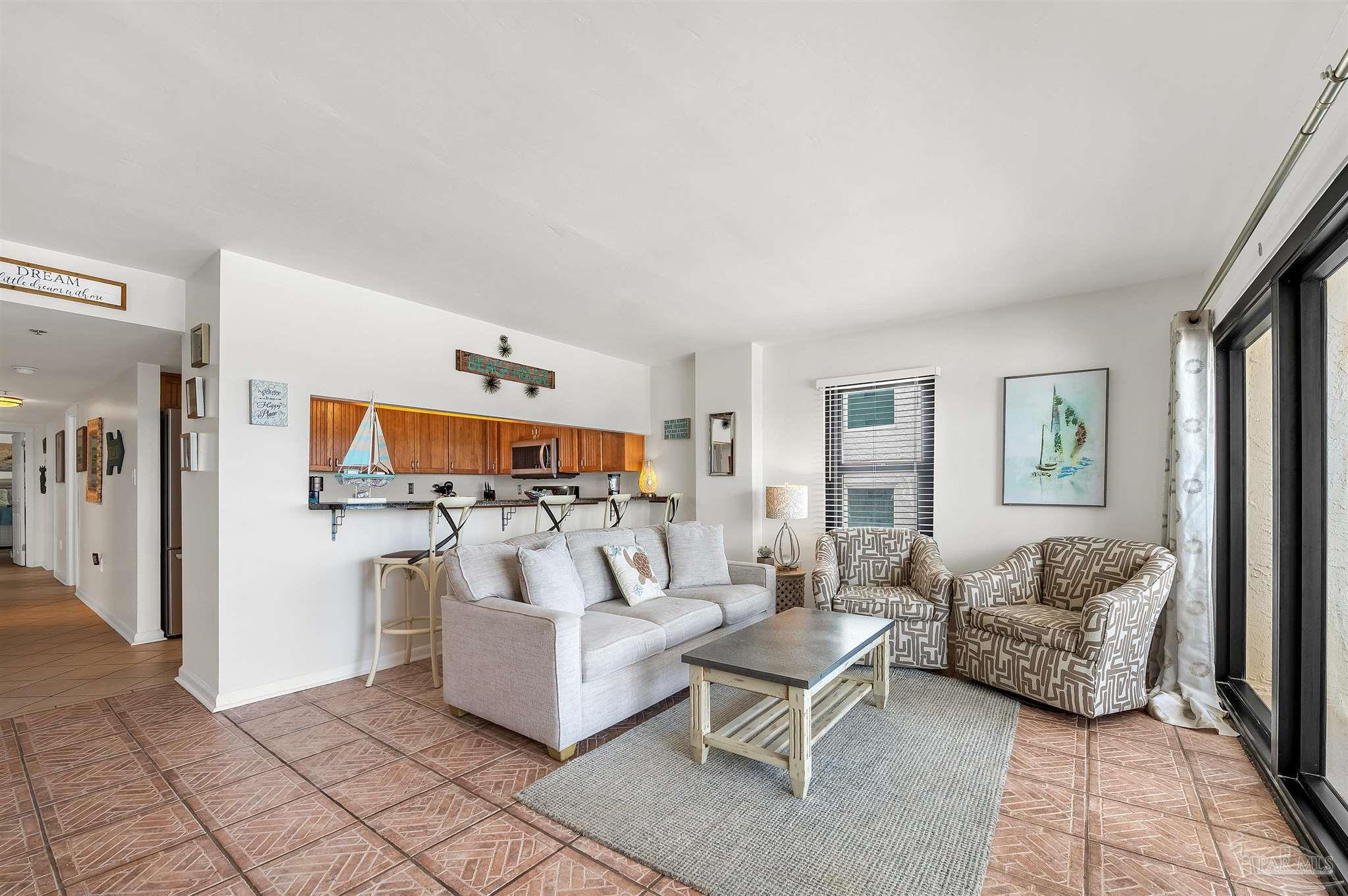 13817 Perdido Key Drive, Unit 501 Pensacola, FL 32507 - Photo 18 of 63 a living room with furniture and a flat screen tv