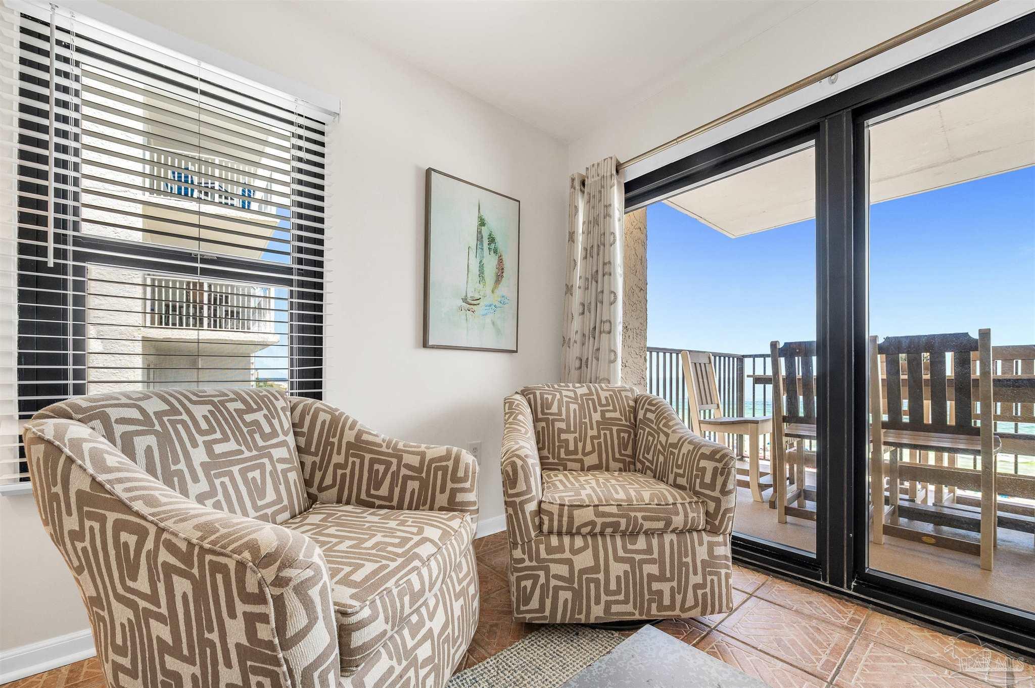 13817 Perdido Key Drive, Unit 501 Pensacola, FL 32507 - Photo 23 of 63 a living room with furniture and a window
