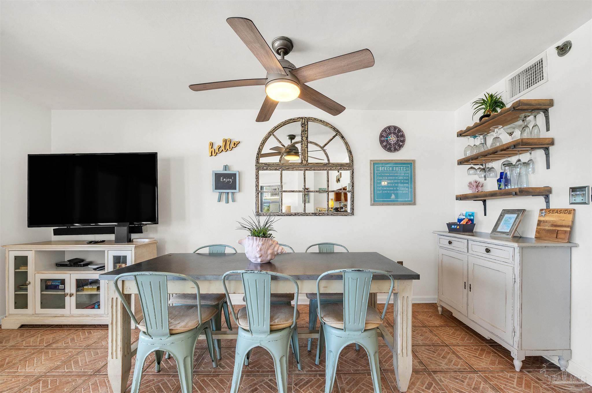13817 Perdido Key Drive, Unit 501 Pensacola, FL 32507 - Photo 26 of 63 a living room with furniture a flat screen tv and a window