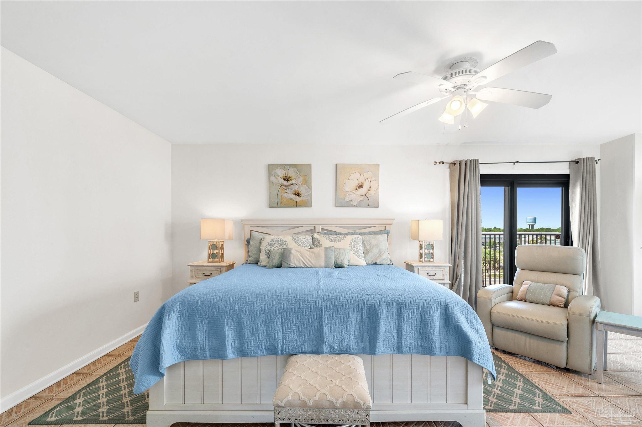 13817 Perdido Key Drive, Unit 501 Pensacola, FL 32507 - Photo 33 of 63 a bedroom with a bed and a couch