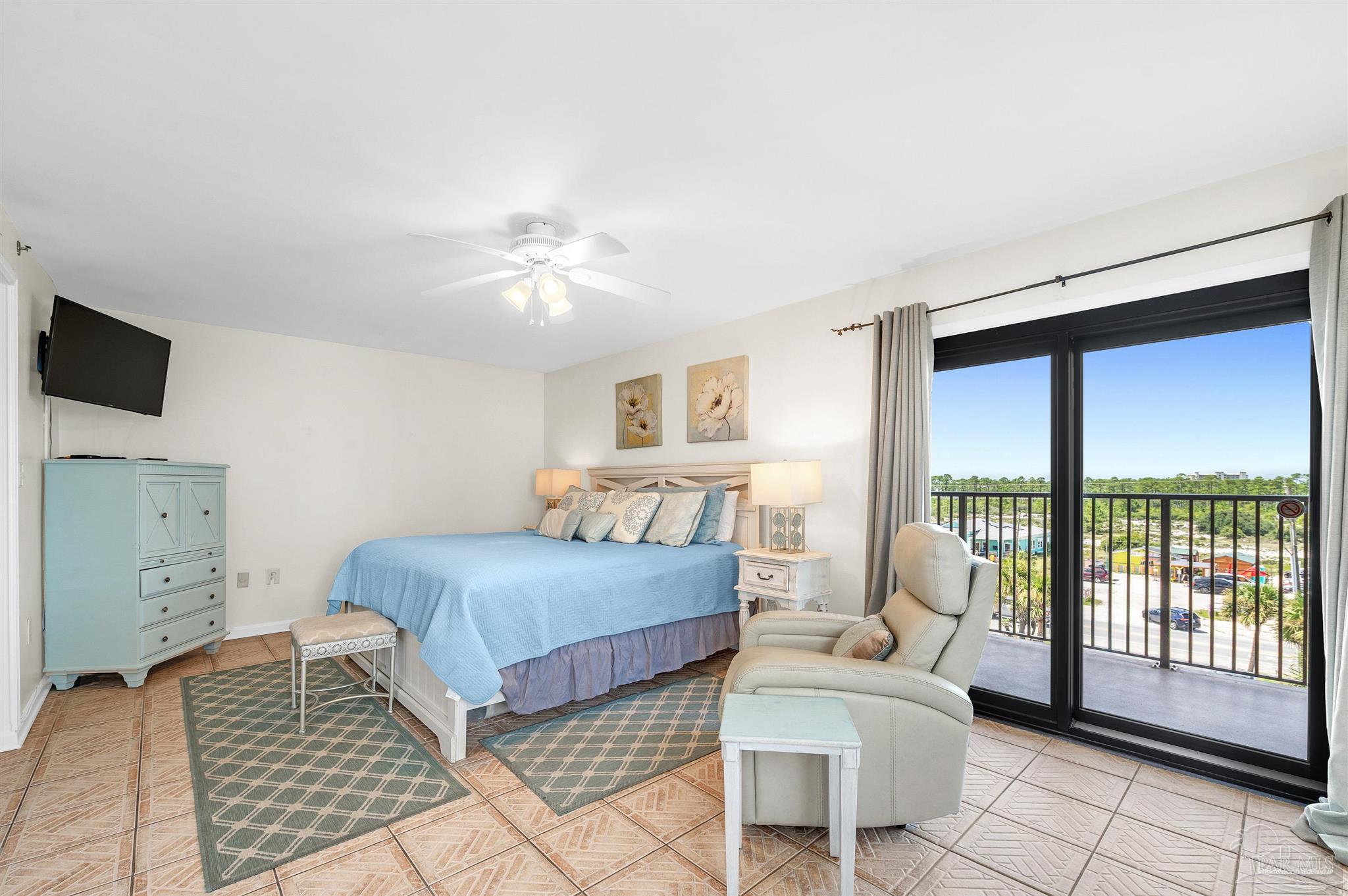 13817 Perdido Key Drive, Unit 501 Pensacola, FL 32507 - Photo 34 of 63 a bedroom with a bed and glass door
