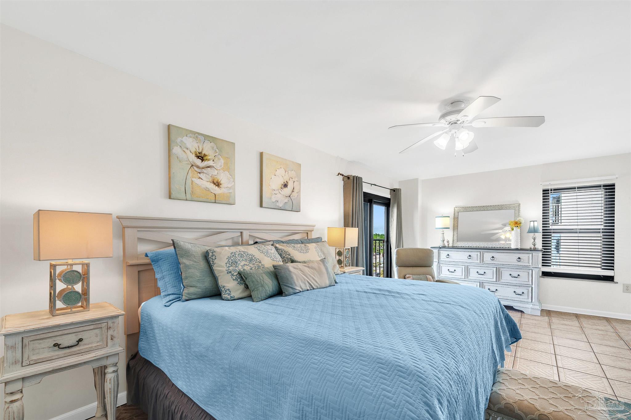 13817 Perdido Key Drive, Unit 501 Pensacola, FL 32507 - Photo 35 of 63 a bedroom with a large bed and a chandelier