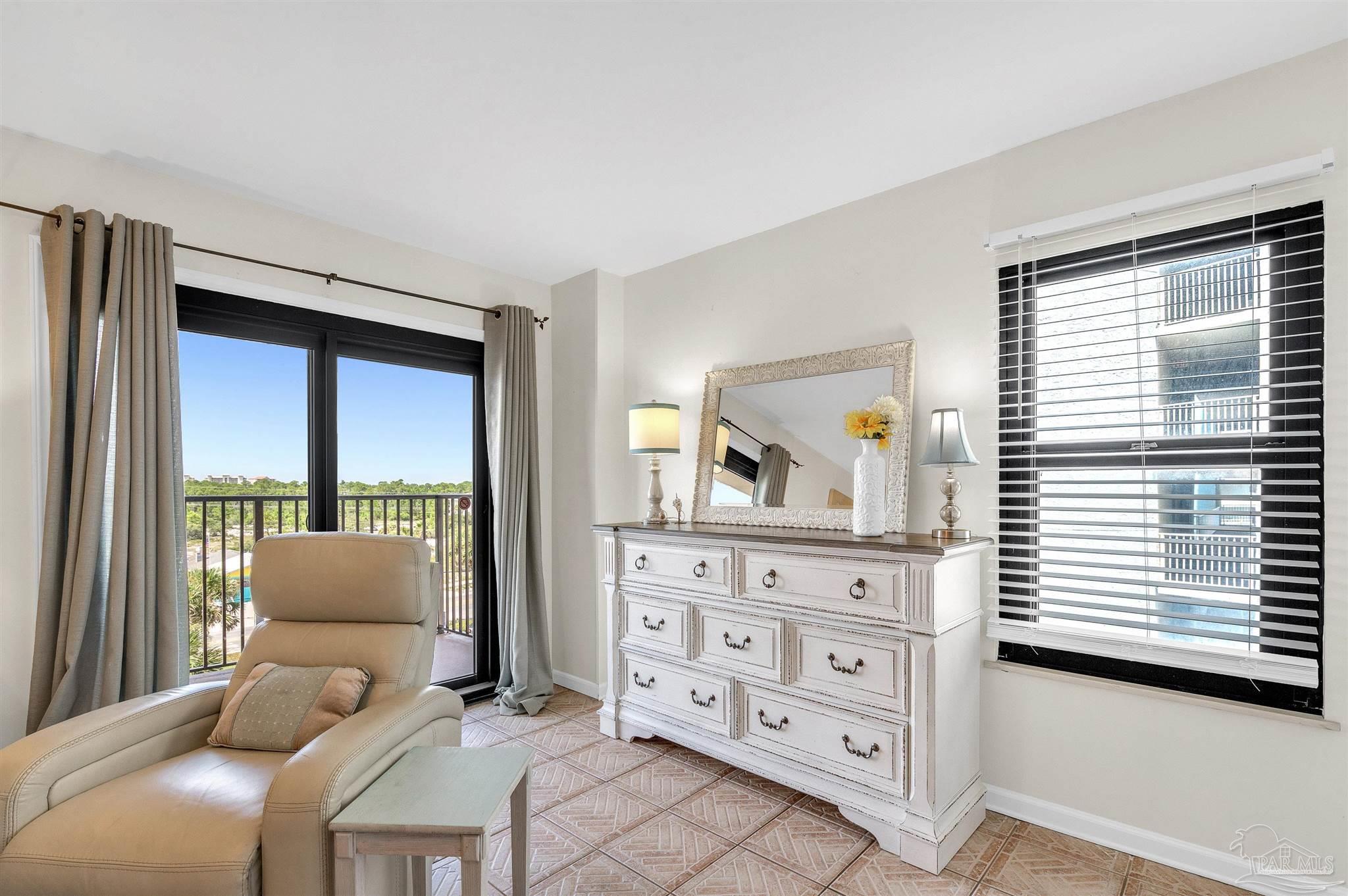 13817 Perdido Key Drive, Unit 501 Pensacola, FL 32507 - Photo 37 of 63 a living room with furniture and a large window