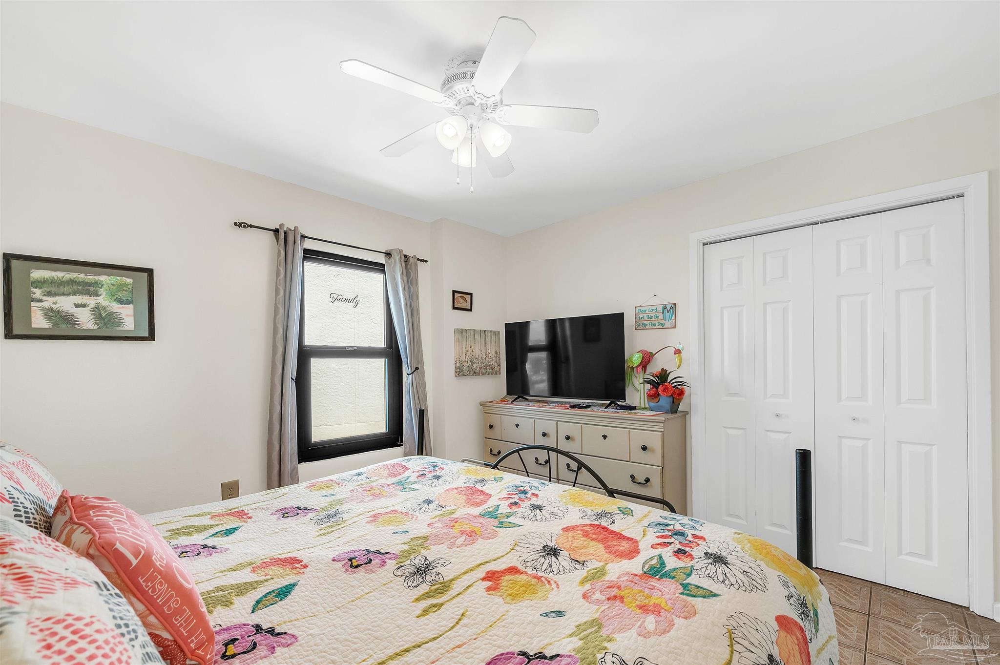 13817 Perdido Key Drive, Unit 501 Pensacola, FL 32507 - Photo 44 of 63 a bedroom with a bed and a flat screen tv