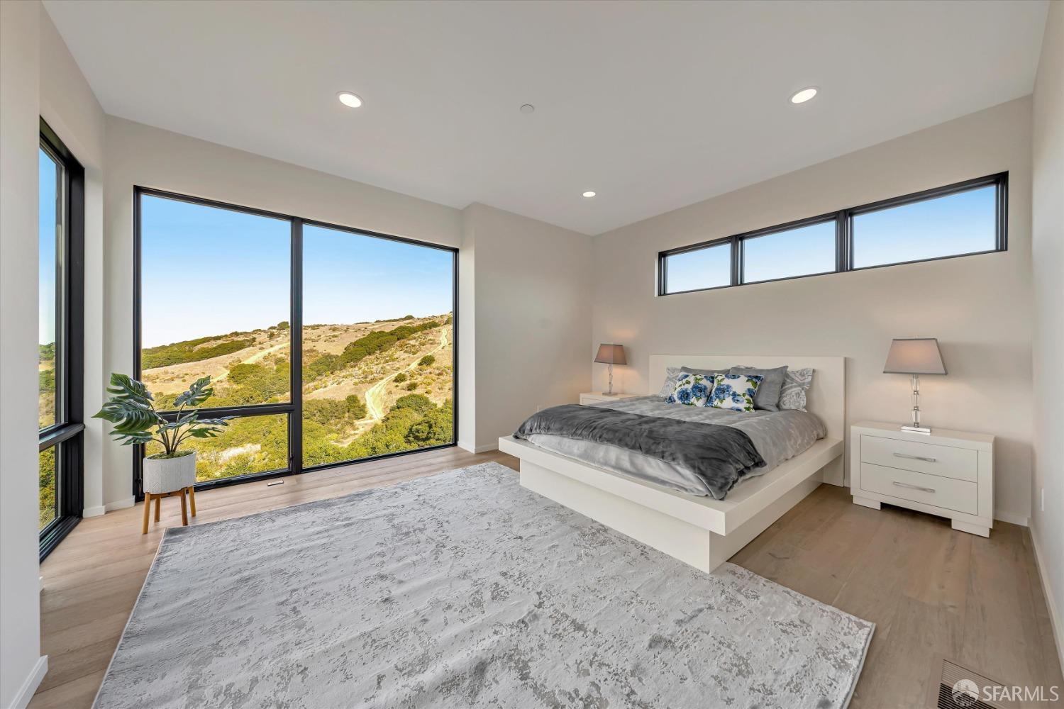 2011 Bishop Road Belmont, CA 94002 - Photo 12 of 35 a spacious bedroom with a bed and a large window