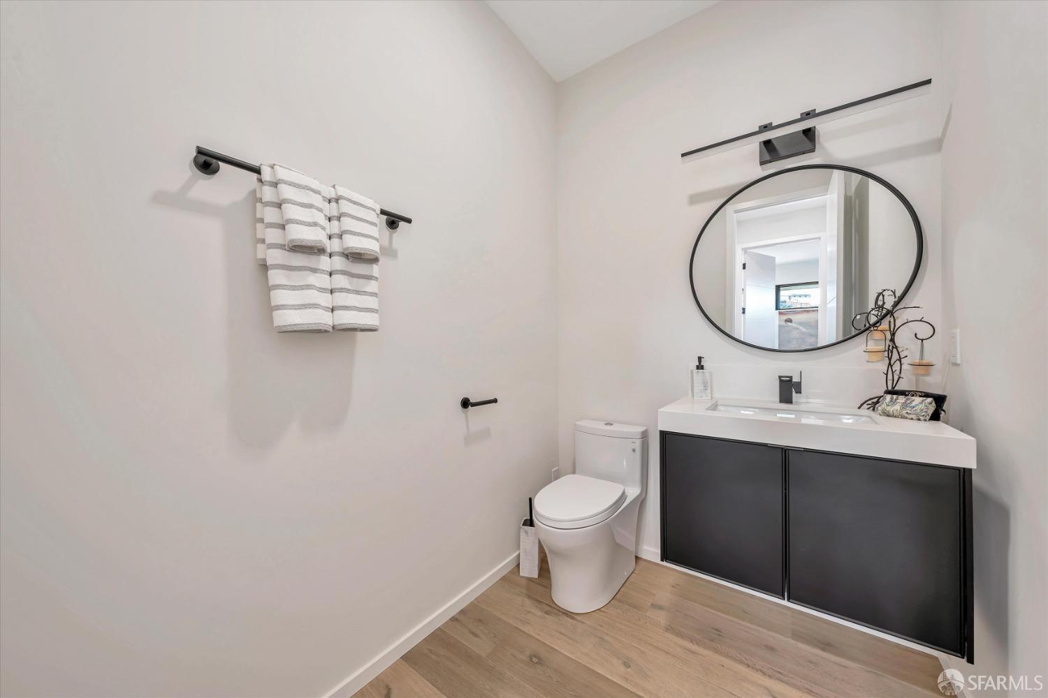 2011 Bishop Road Belmont, CA 94002 - Photo 16 of 35 a bathroom with a toilet a sink and mirror