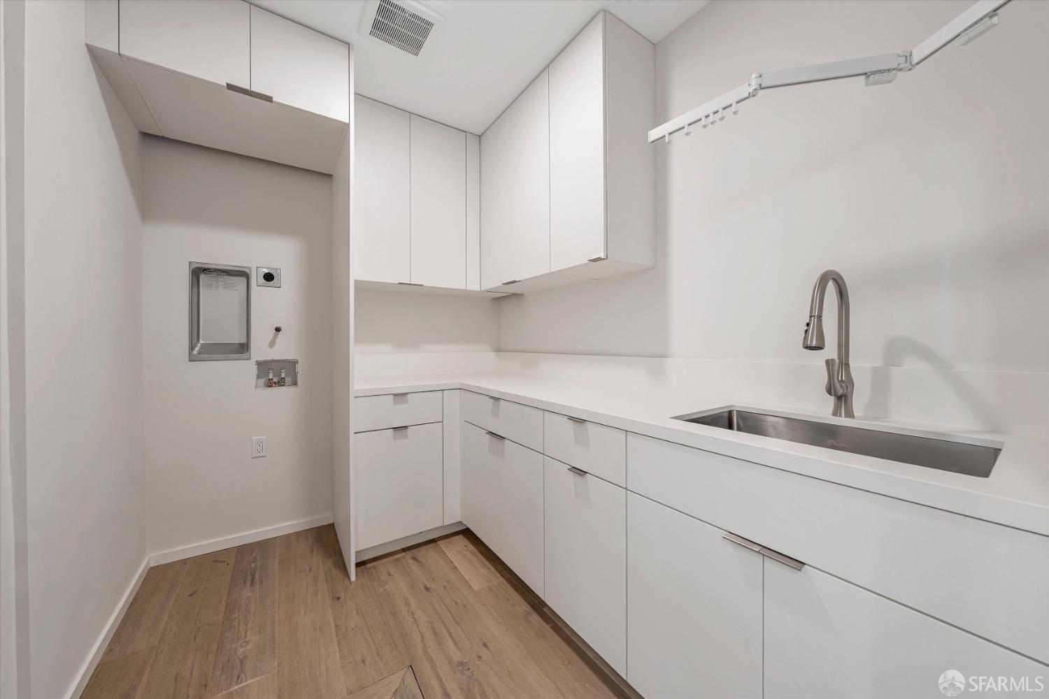 2011 Bishop Road Belmont, CA 94002 - Photo 25 of 35 a kitchen with a sink cabinets and appliances