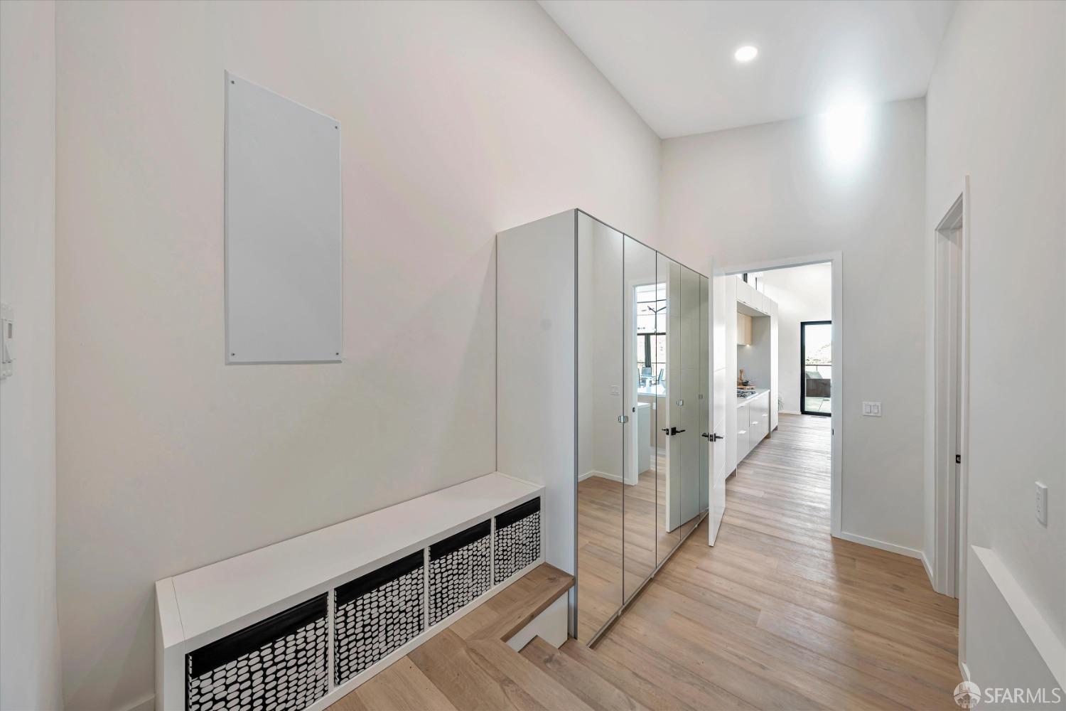 2011 Bishop Road Belmont, CA 94002 - Photo 9 of 35 a view of a hallway with wooden floor and staircase