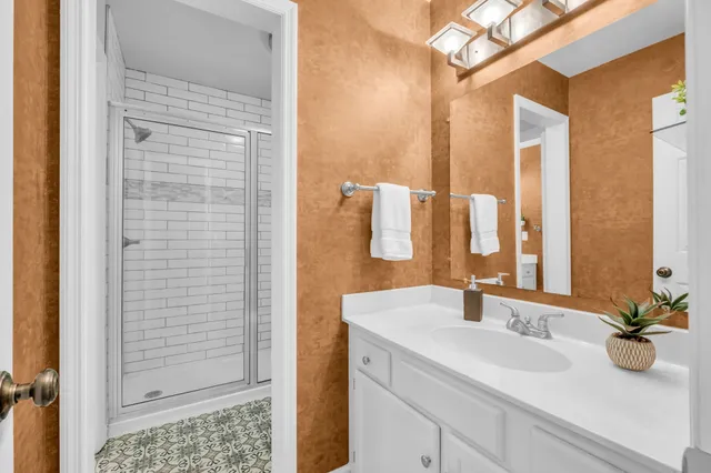 a bathroom with a sink and a mirror