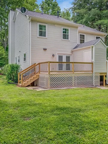 a view of balcony with wooden floor and outdoor seating