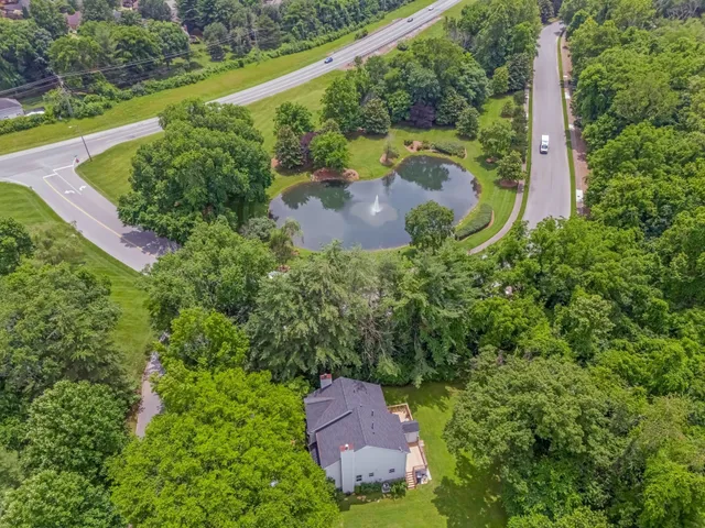an aerial view of a city and lake view