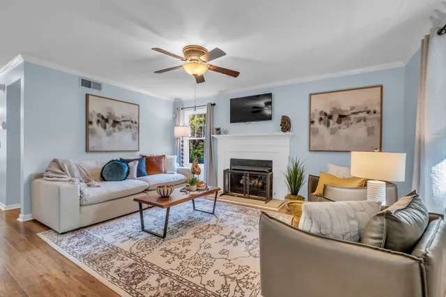 a living room with furniture and a fireplace
