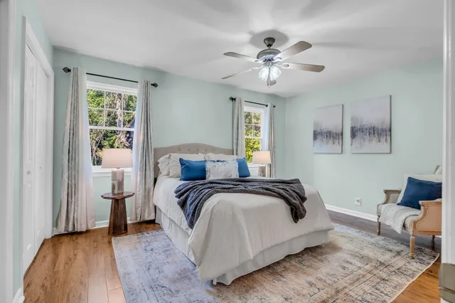 a bedroom with a bed and lamp