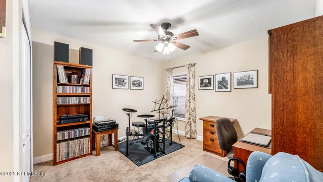 a view of a livingroom with furniture and workspace