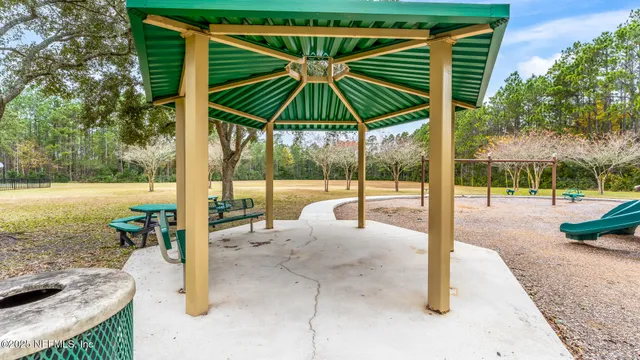 a aerial view of a house with a yard