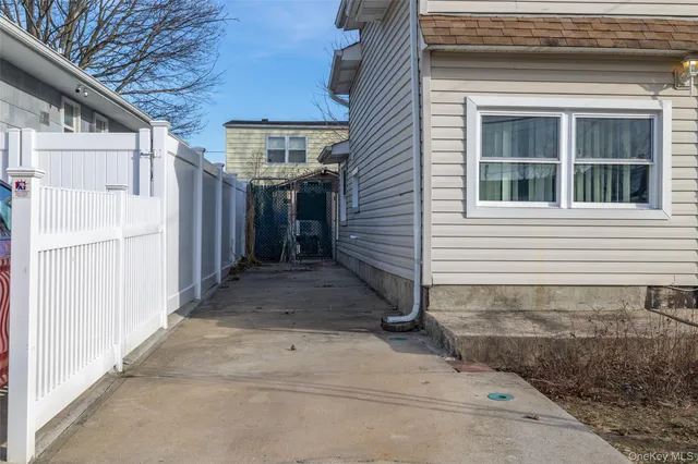 a view of a house with a large tree
