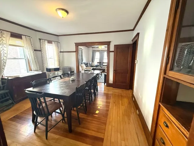 a view of a dining room with furniture and window