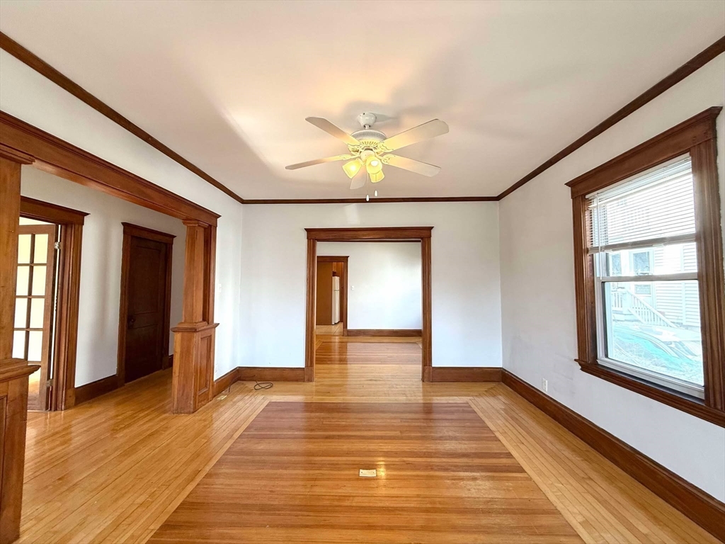 41 Woodward Avenue, Unit 2 Quincy, MA 02169 - Photo 17 of 27 a view of an empty room with window and wooden floor