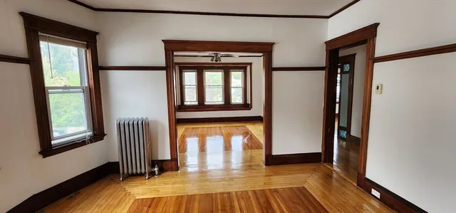 a view of front door with wooden floor