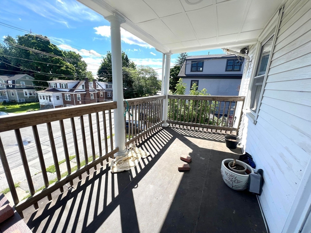 41 Woodward Avenue, Unit 2 Quincy, MA 02169 - Photo 22 of 27 a balcony with chairs